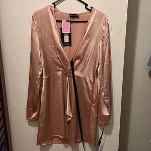 Pretty little thing , nude , satin long sleeved wrap dress. Never worn , size 6